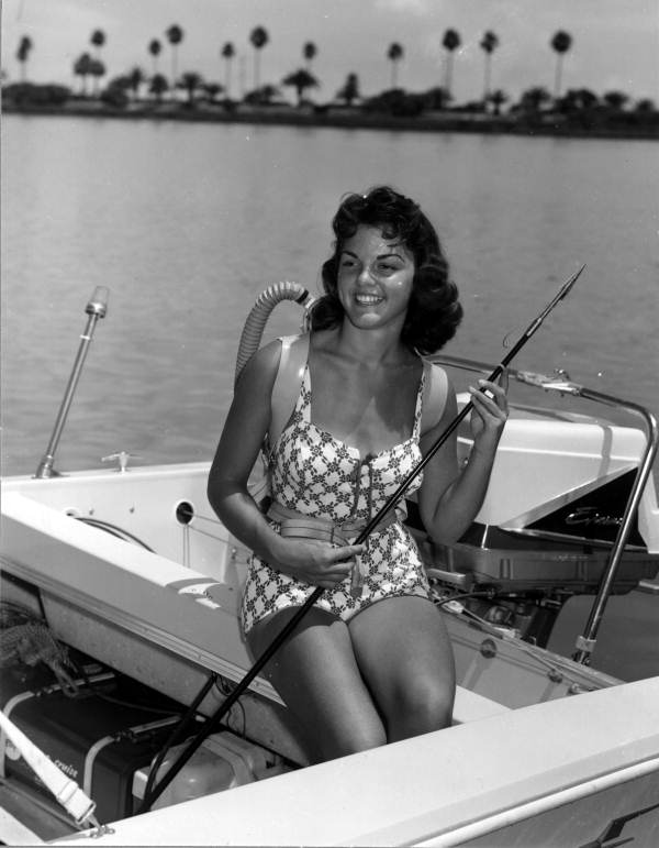 Carol Clough holds a spear - Clearwater, Florida .