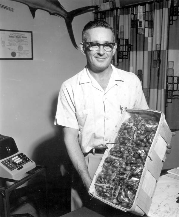 Bill Grabor holding box of packaged radishes - Belle Glade, Florida