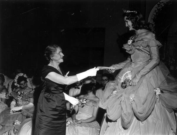 Mrs. W.A. Saunders presenting scholarship to Jeanie Queen Cheryl Jane Claiborne.