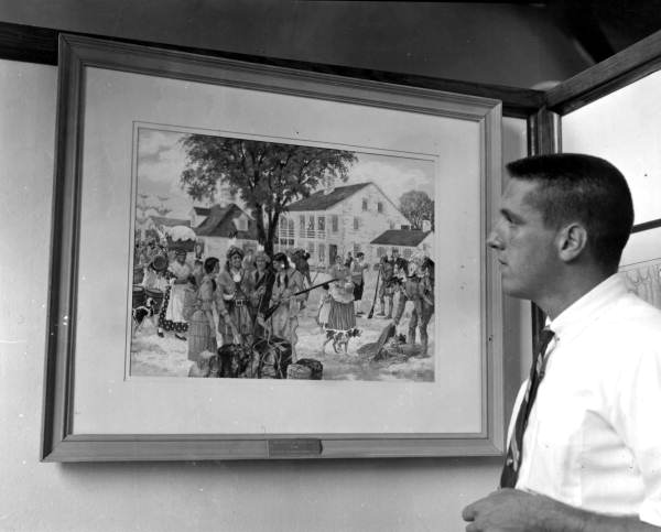 Man viewing a painting