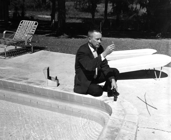 Unidentified man tests water in a swimming pool - Tallahassee, Florida .