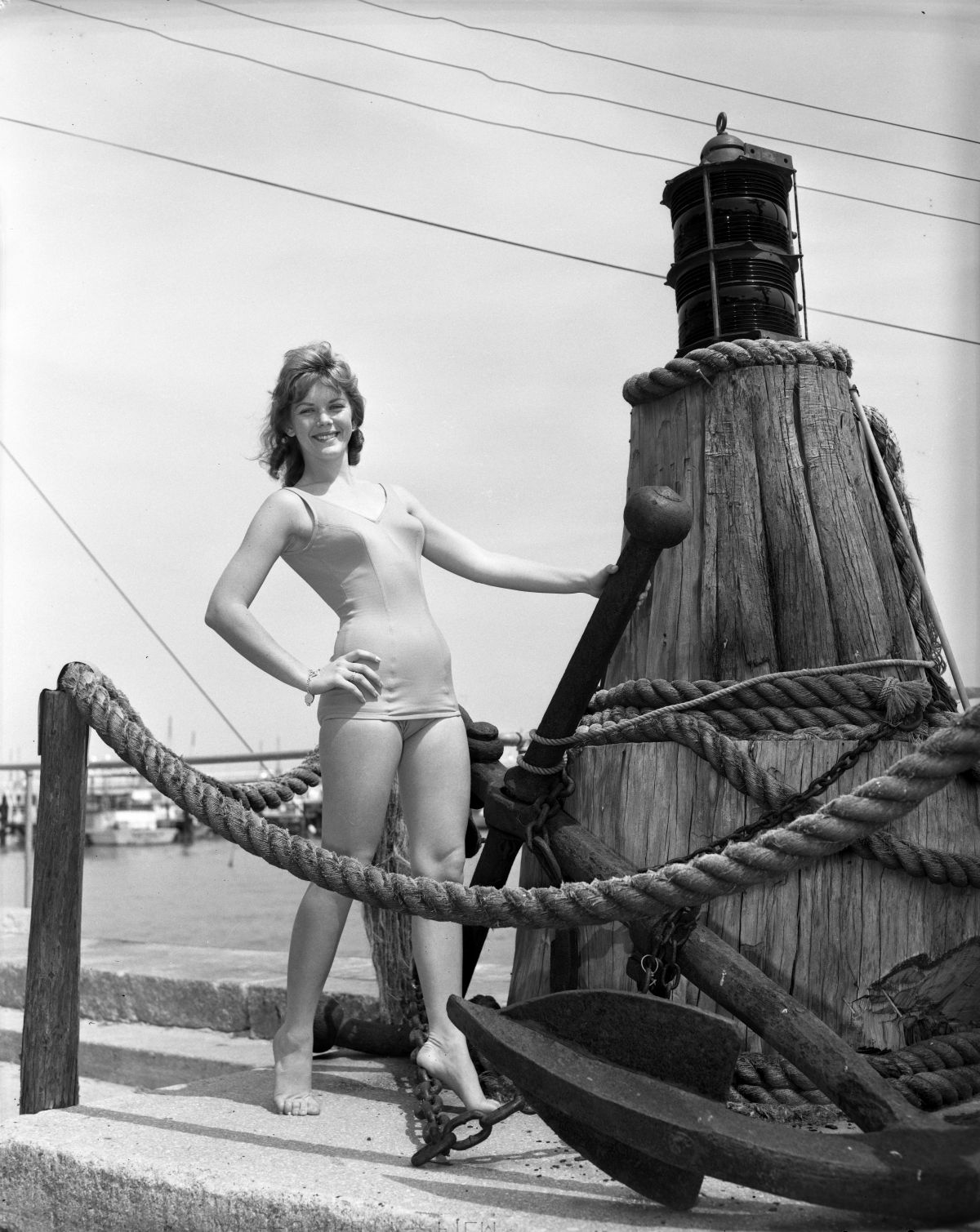 Susan Deen posed next to a large anchor - Bunnell, Florida.