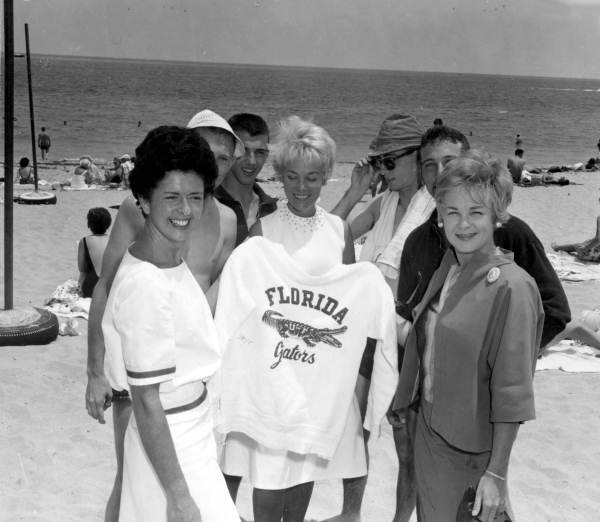 Women from a world wide tour pose for pictures at the beach during Easter vacation - Fort Lauderdale, Florida.