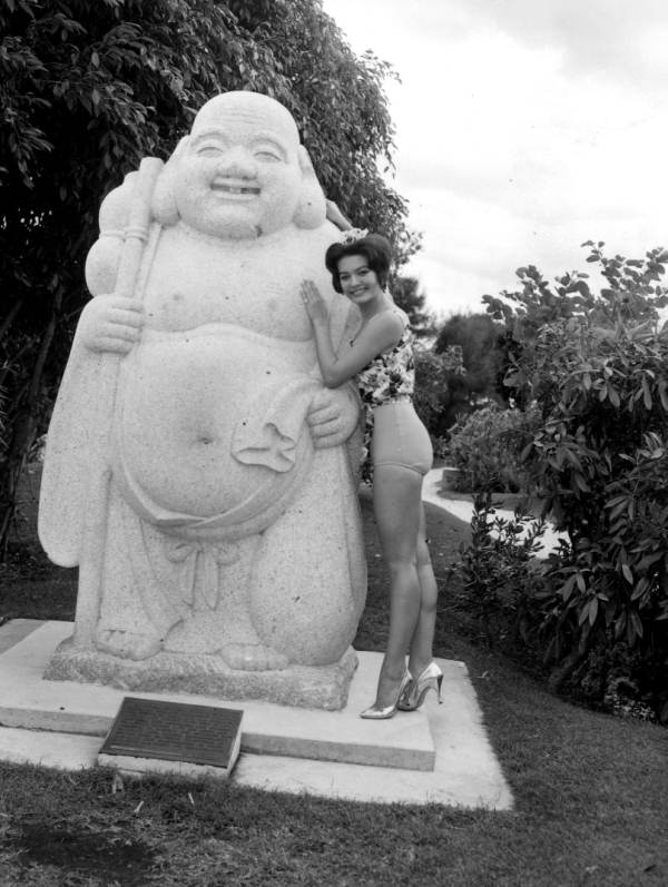 Miss Florida 1962, Gloria Brody, posing next to a Japanese statue - Miami, Florida