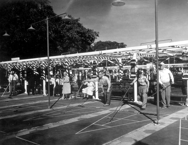 Players on a shuffleboard court