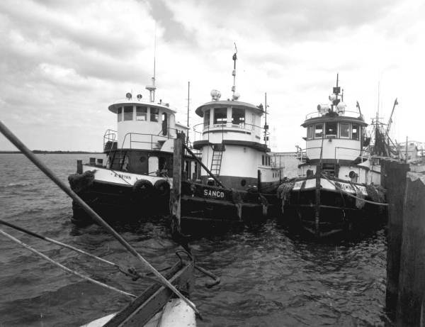 Three tug boats at the city dock - Apalachicola, Florida.