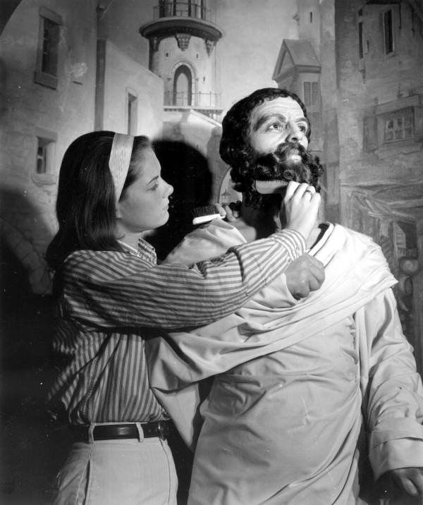A young woman maintaining a bearded figure at Potter's Wax Museum - Saint Augustine, Florida