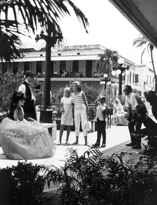 A family takes pictures in Ybor City - Tampa, Florida.