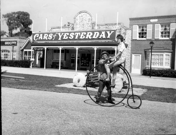 Woman on old bicycle at Bellm's Cars and Music of Yesterday