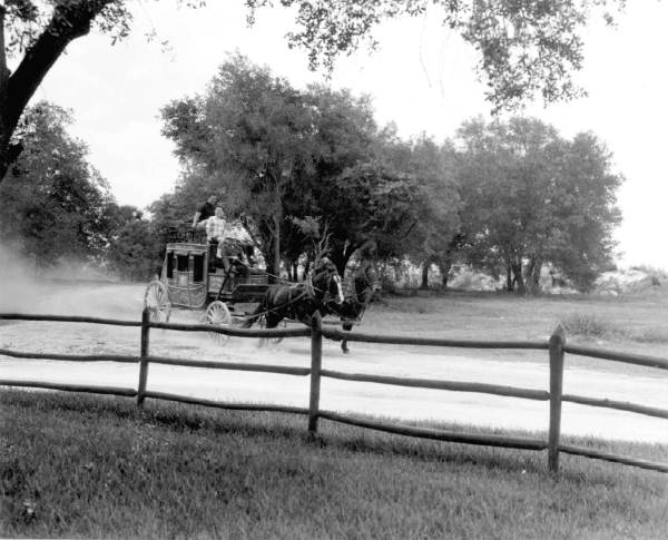 Visitors on stagecoach at Pioneer City - Davie, Florida.