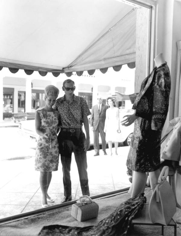 Couple window shopping on Worth Avenue - Palm Beach, Florida.