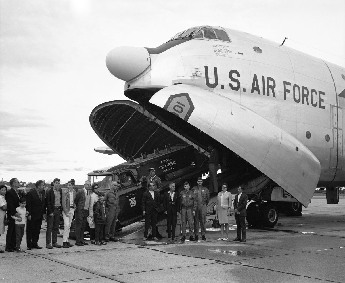 National Fish Hatchery truck being unloaded from an Air Force airplane