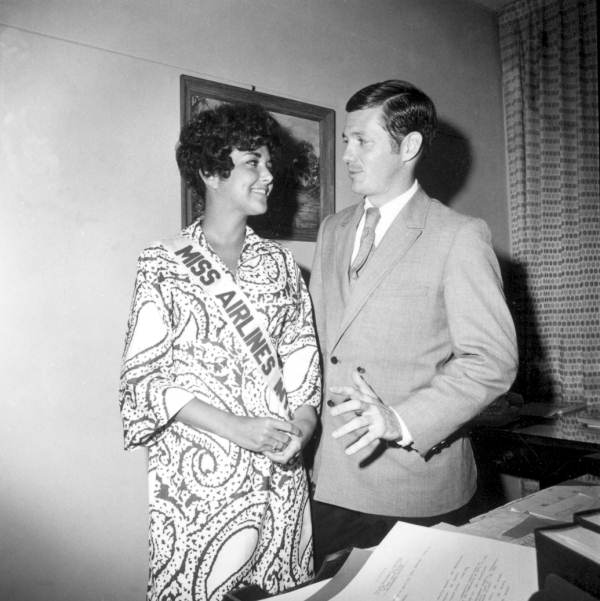Jean Hartnett, Miss Airlines International, standing with a man