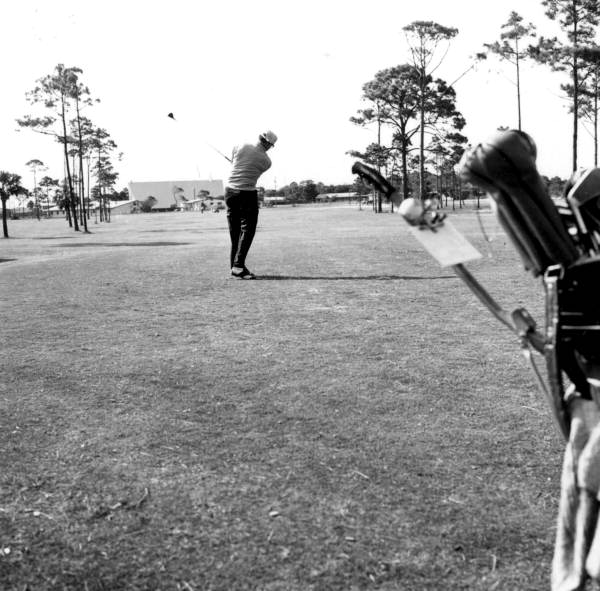 Unidentified man plays golf - Panama City, Florida