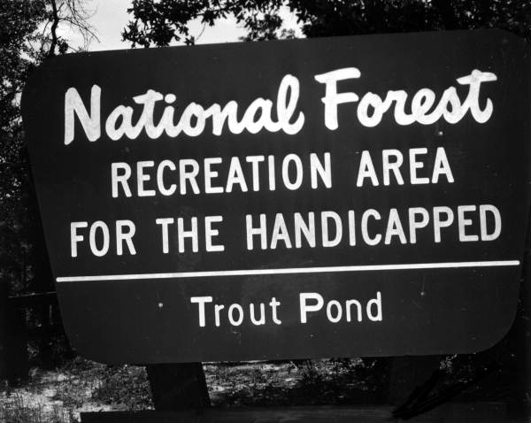 A sign of "National Forest Recreation Area for the Handicapped" - Apalachicola National Forest, Florida.
