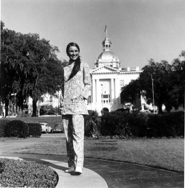 Young woman models the new uniforms for the Welcome Station