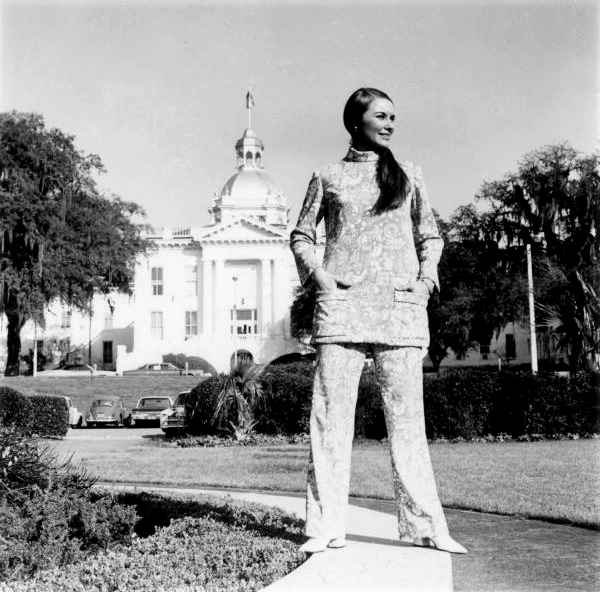 Young woman models the new uniforms for the Welcome Station