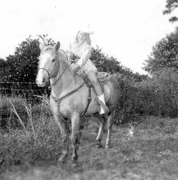 "Miss Sandy Shoes" queen Jan Arnold (later Russell) on horseback at the Sandy Shoes Festival in Ft. Pierce, Florida.
