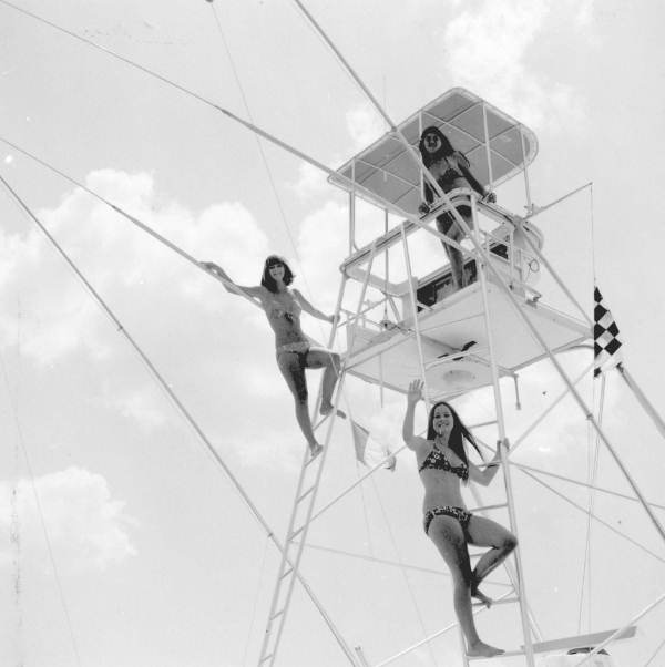 Three high school girls perched atop a yacht at a Eau Gallie yacht basin