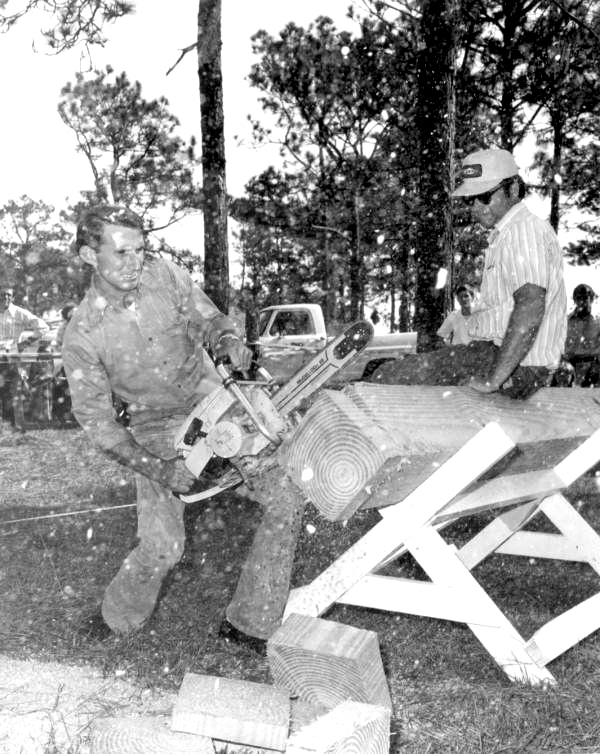 Sawing wood at the Florida Forest Festival.