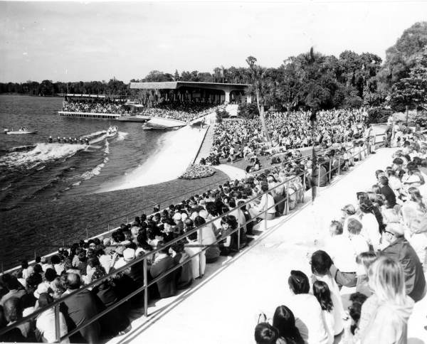 Spectators watching motorboat and water skiers at Cypress Gardens - Winter Haven, Florida