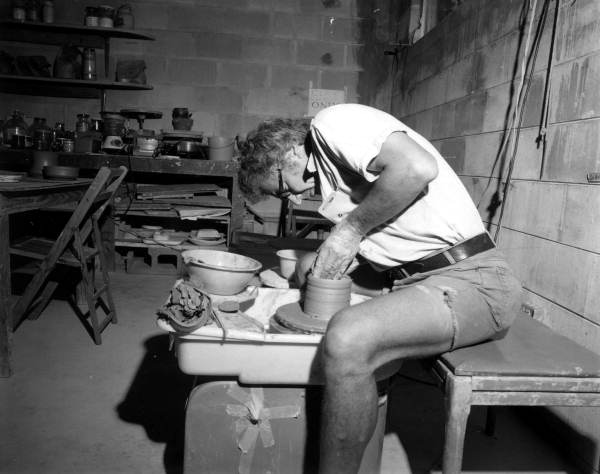 Potter makes a ceramic pot