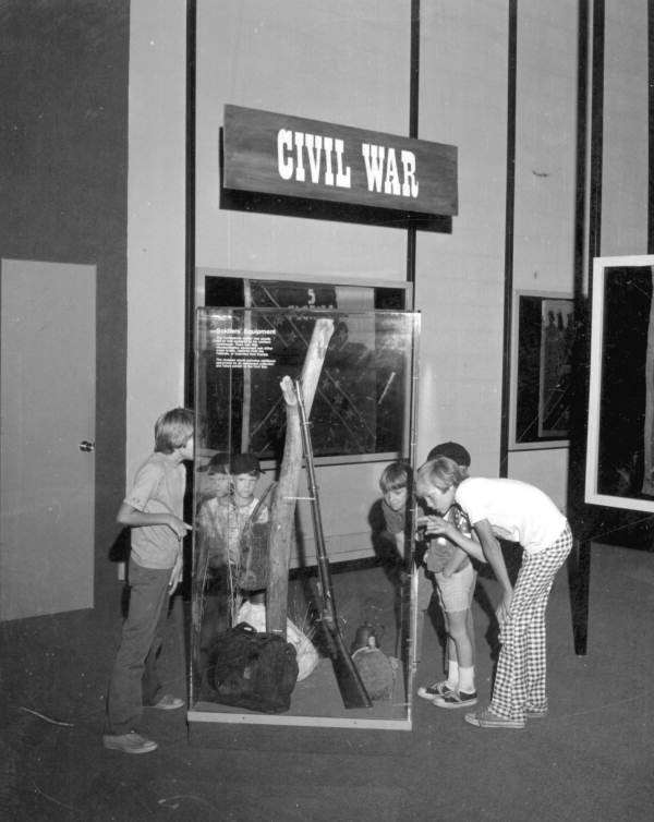 Boys viewing Civil War soldiers' equipment displayed at the Museum of Florida History - Tallahassee, Florida