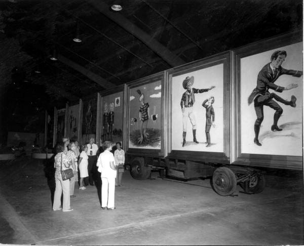 People viewing freak show illustrations- Sarasota, Florida.