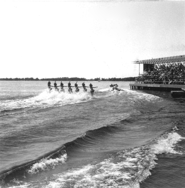 Spectators watching motorboat and water skiers at Cypress Gardens - Winter Haven, Florida
