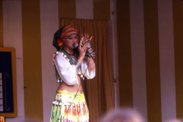 Woman singing while holding a snake during performance at the Busch Gardens amusement park - Tampa, Florida.