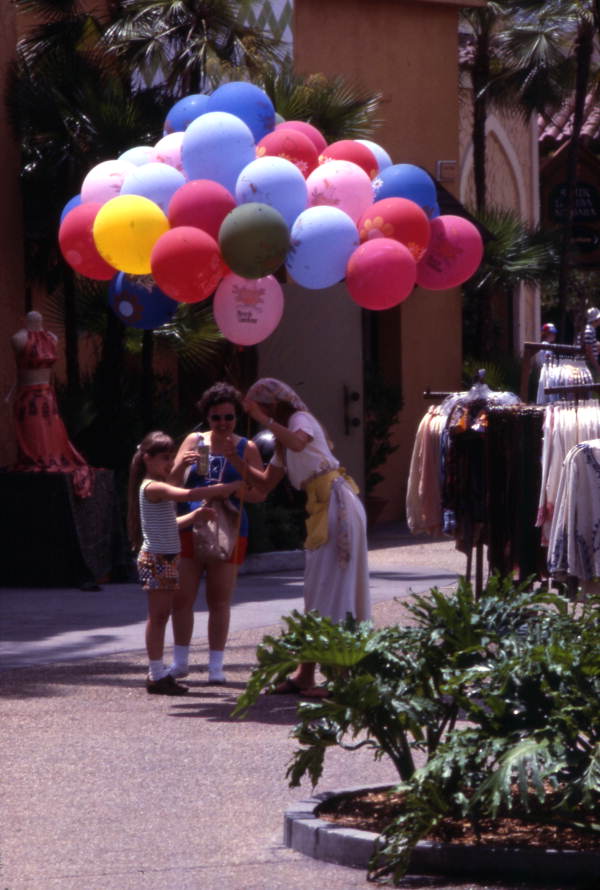 Visitor receiving balloon at the Busch Gardens amusement park - Tampa, Florida.