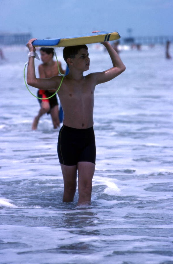 Boy with bodyboard at Daytona Beach.