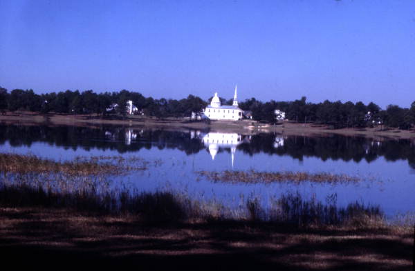 Scenic view looking across Lake De Funiak toward the Walton County Chamber of Commerce building on Circle Drive in De Funiak Springs, Florida.
