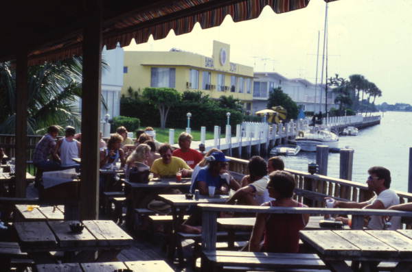People dining outdoors at the Bahia Cabana Beach Resort & Marina restaurant in Ft. Lauderdale, Florida.