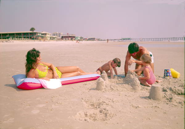 Family building a sand castle at the beach - Jacksonville, Florida