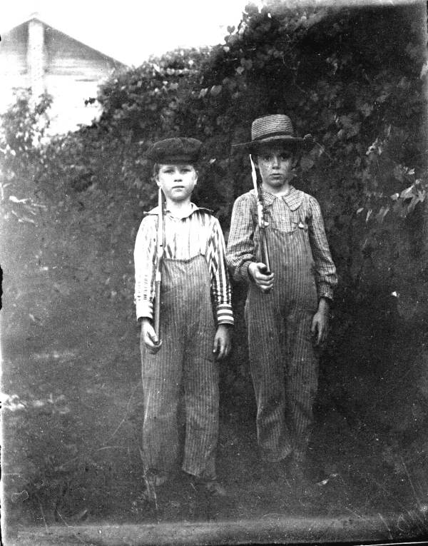 Two boys with their guns at 'parade rest'