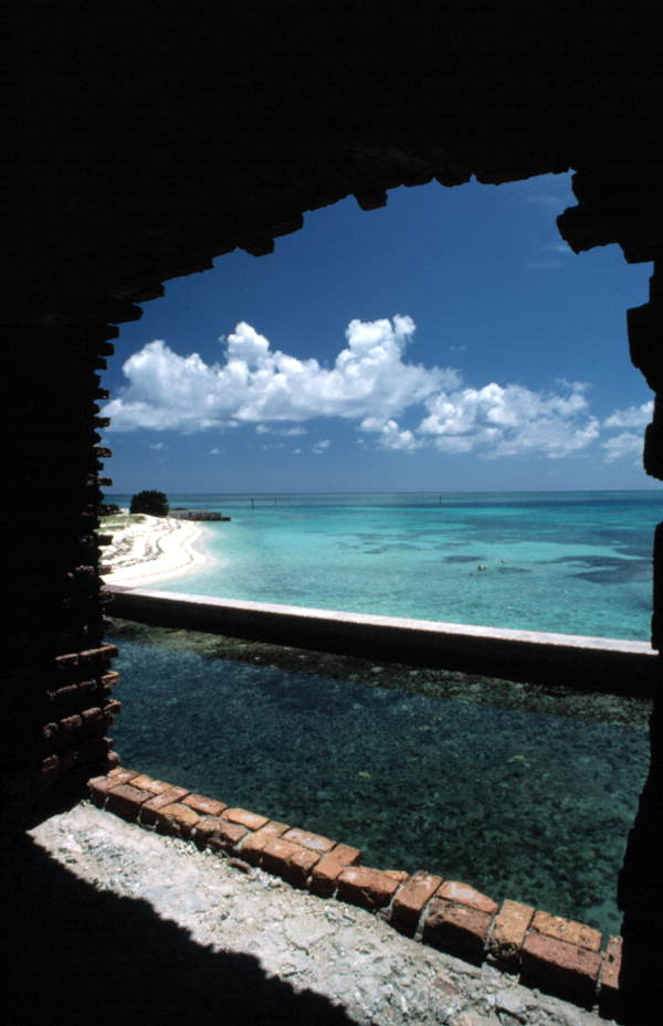 Looking out of Fort Jefferson across moat towards a small section of beach - Dry Tortugas, Florida