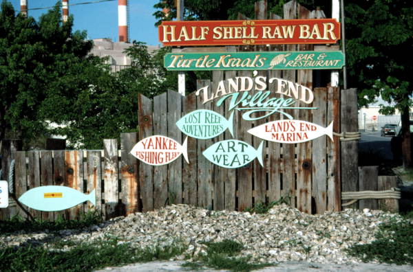 Old "Land's End Village" sign on Caroline Street, Key West, Florida..