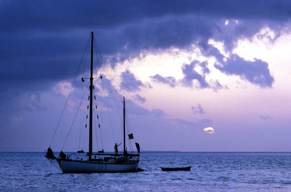 People on sailboat enjoying the view of a sunset - Key West, Florida