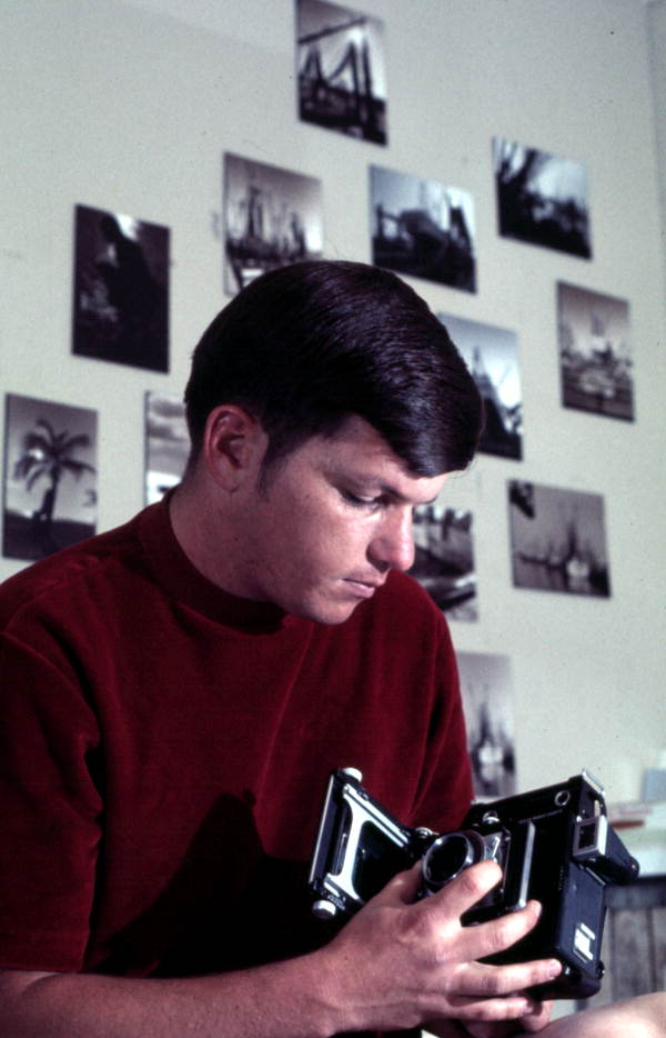 Sergeant 2nd Class Dale M. McDonald, base photographer, in his barracks room.