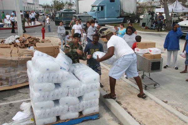 National Guard personnel distributing ice at the Key West High School to people displaced by Hurricane Wilma.