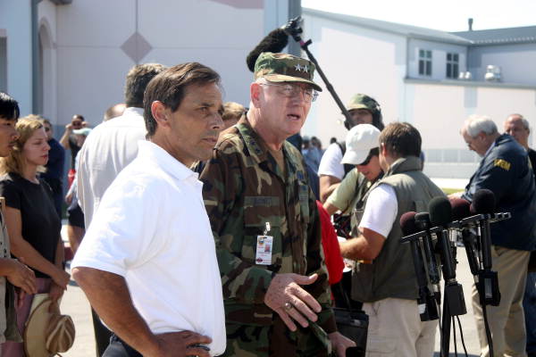 National Guard General Douglas Burnett and FEMA official answer questions from the media..