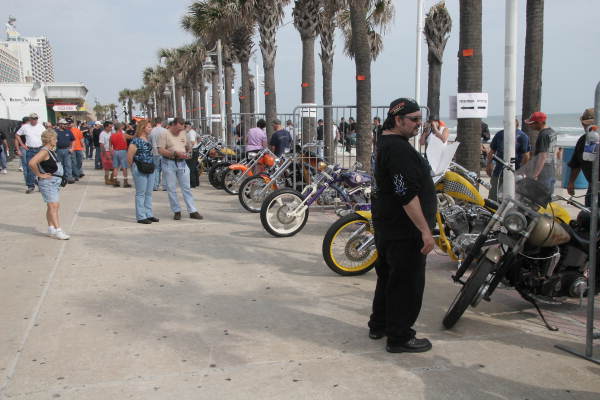 Motorcycles lining boardwalk for custom bike show during Bike Week - Daytona Beach, Florida.