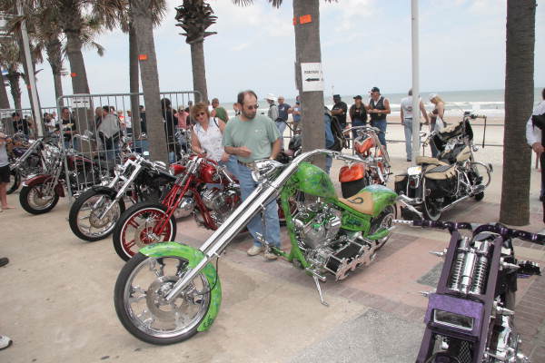 Motorcycles displayed on boardwalk for custom bike show during Bike Week - Daytona Beach, Florida.