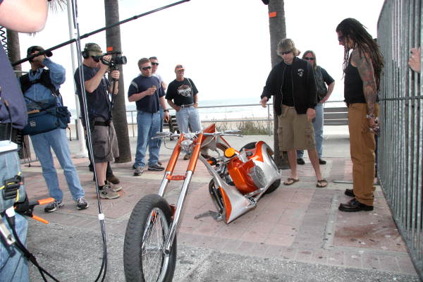 Brandon Baughman talking about his bike to custom bike builder Billy Lane at Boardwalk Chopper and Custom Bike Show