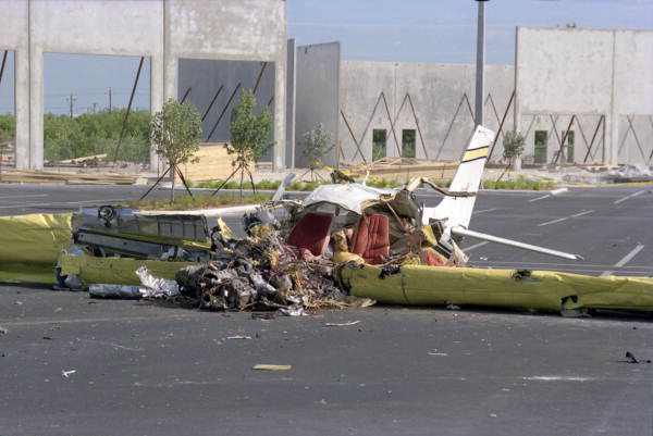 Remains of Beechcraft airplane that crashed into the parking lot of the under construction "Overseas Market Place" shopping center on N. Roosevelt Blvd.