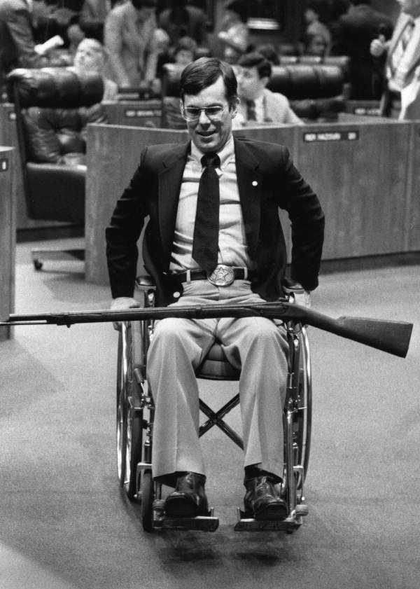 Rep. Larry Hawkins with a Civil War era musket on his lap - Tallahassee, Florida.