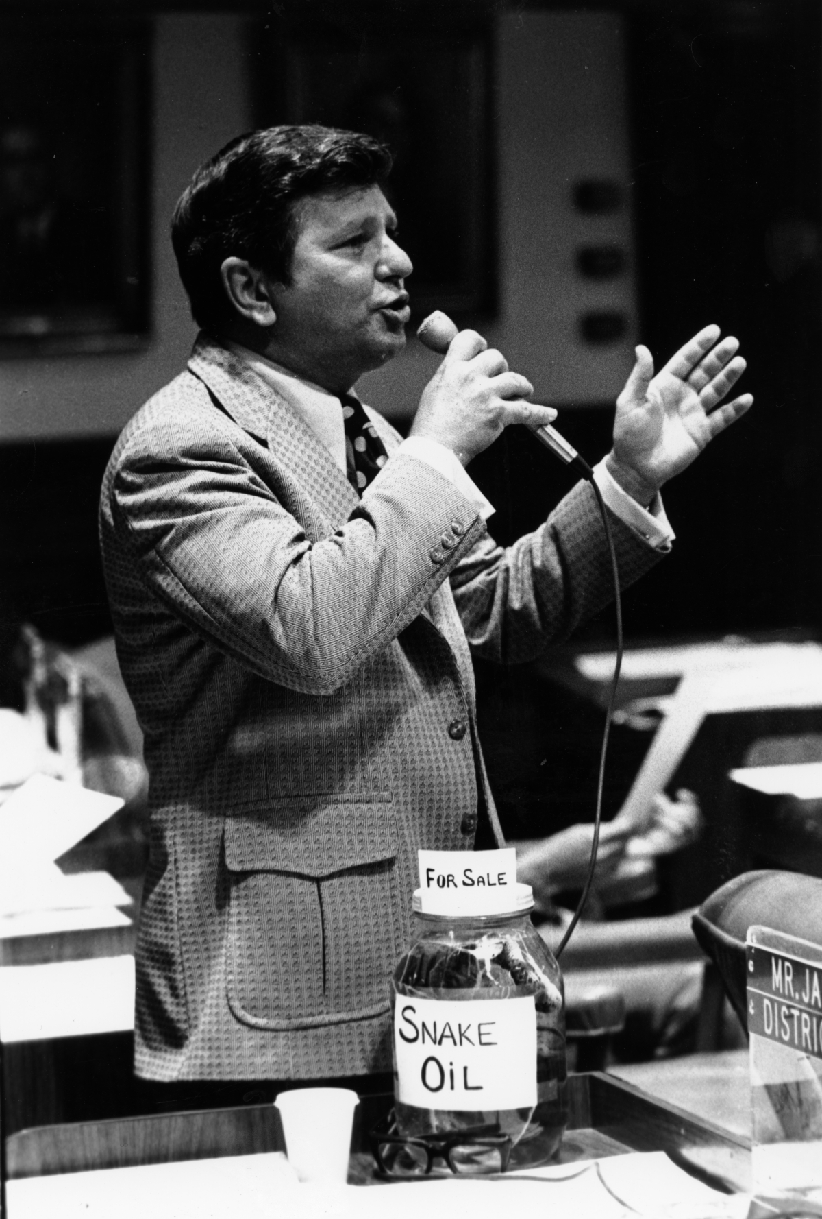 Representative Bill James with a jar of snake oil addresses the House - Tallahassee, Florida.