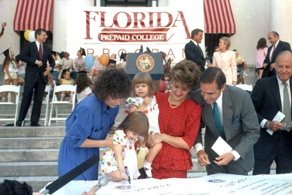 Governor Robert "Bob" Martinez and family signing Prepaid College Program contracts in Tallahassee, Florida.