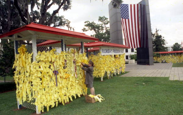Yellow ribbons on a wire mesh "Florida's Freedom Wall" near the memorial to Vietnam War veterans - Tallahassee, Florida.